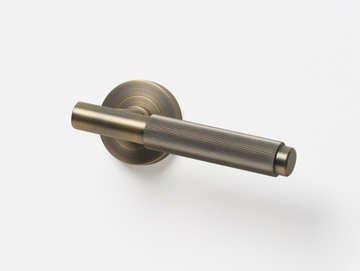 LINEAR - Brass door handle on rose by Lo & Co Interiors - view 2